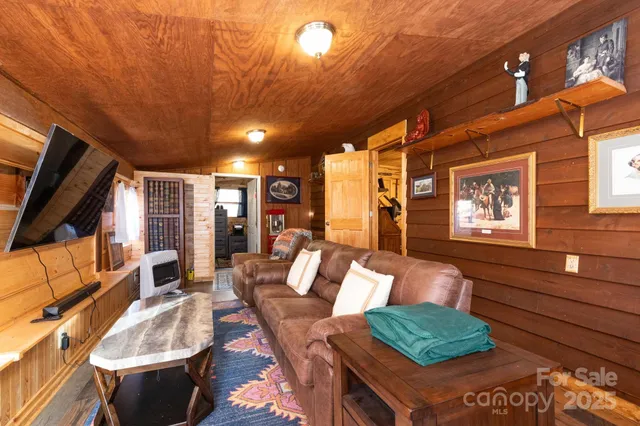 a bedroom with furniture and wooden floor