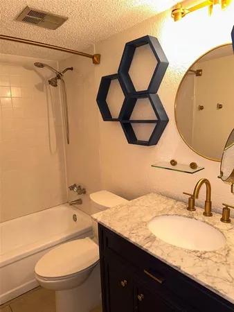 a bathroom with a sink a mirror and a toilet