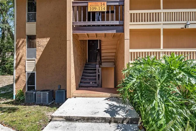 a kitchen with stainless steel appliances granite countertop a stove a refrigerator and a sink