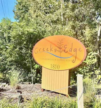 a kitchen with a refrigerator and a stove