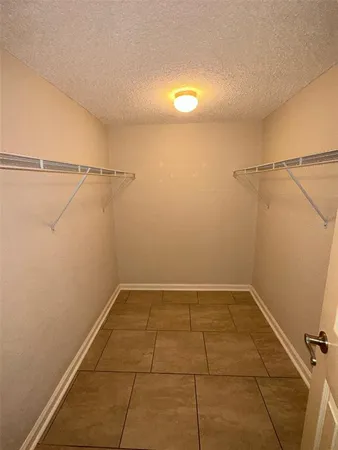 a bathroom with a double vanity sink toilet mirror and shower