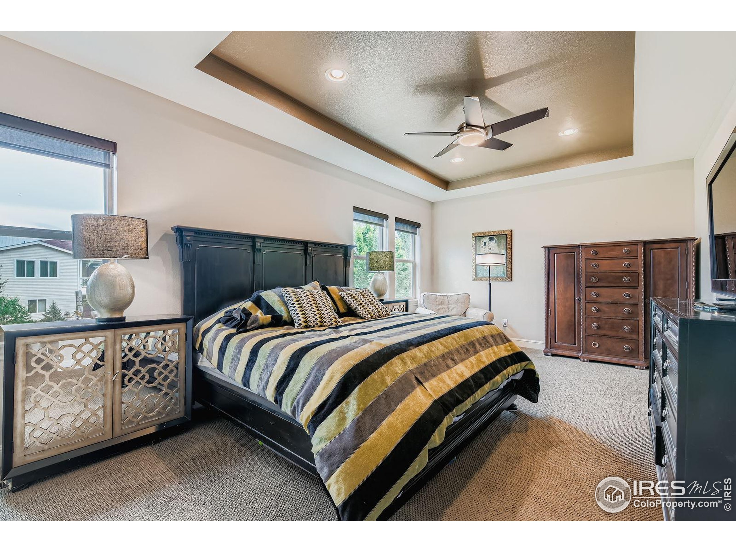 10834 Graphite Street Broomfield, CO 80021 - Photo 14 of 34 a bed room with a bed and a ceiling fan