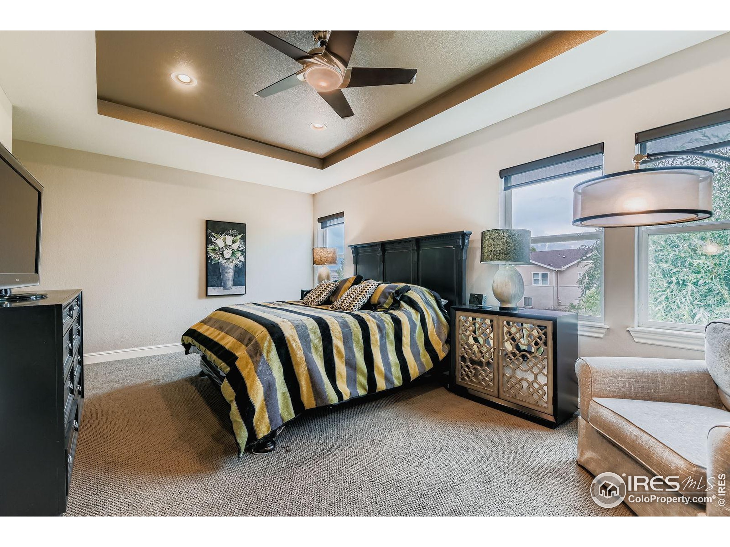 10834 Graphite Street Broomfield, CO 80021 - Photo 15 of 34 a bedroom with furniture and a window