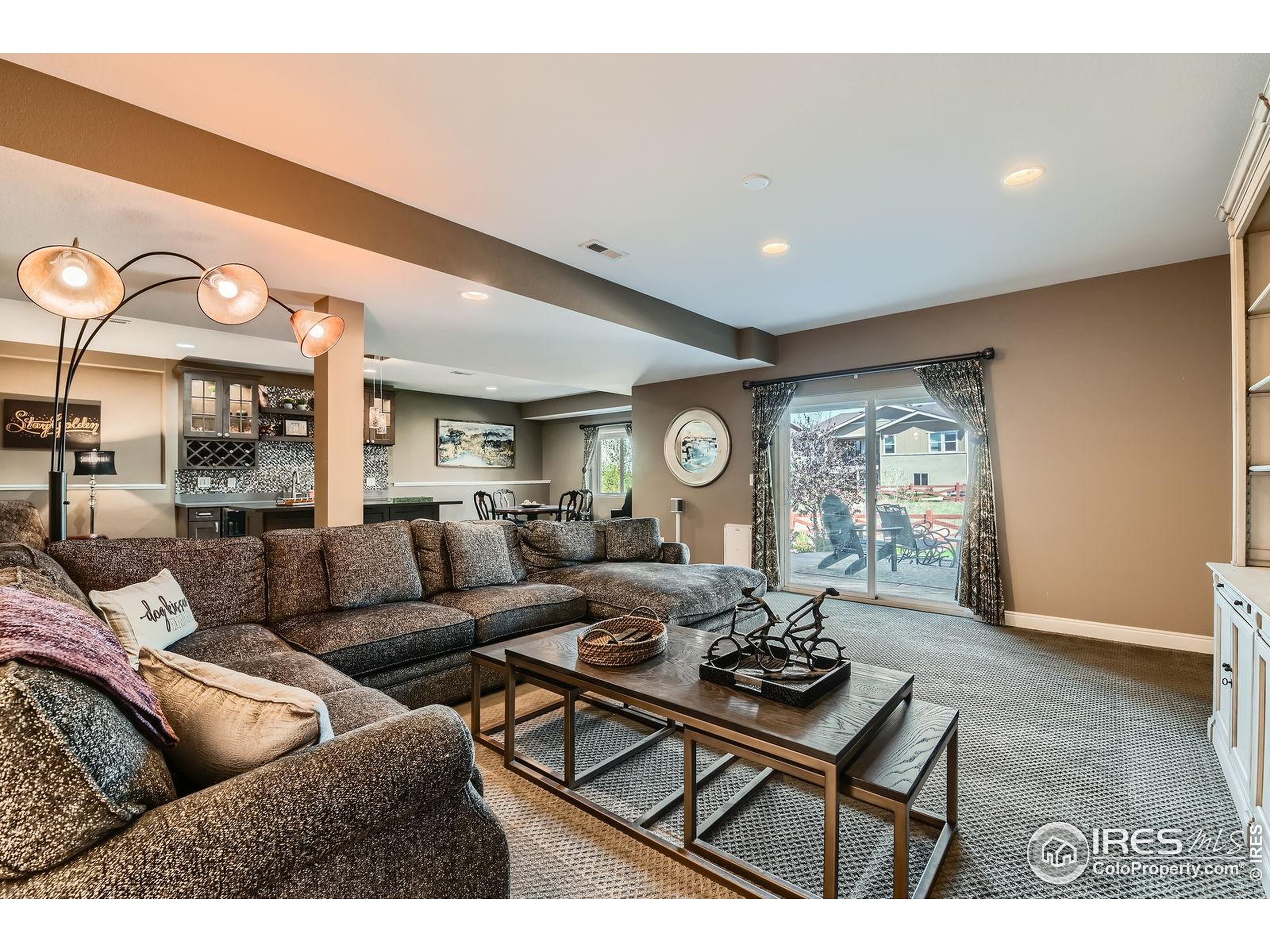 10834 Graphite Street Broomfield, CO 80021 - Photo 18 of 34 a living room with furniture and a large window