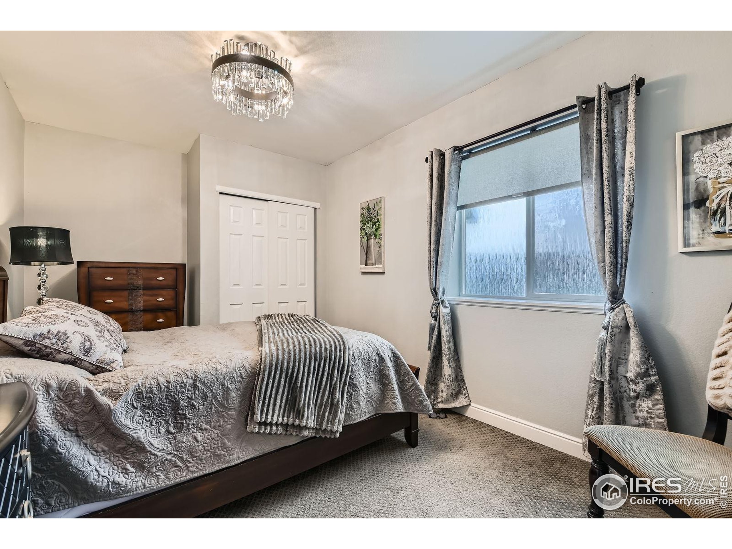 10834 Graphite Street Broomfield, CO 80021 - Photo 21 of 34 a bedroom with a bed and window