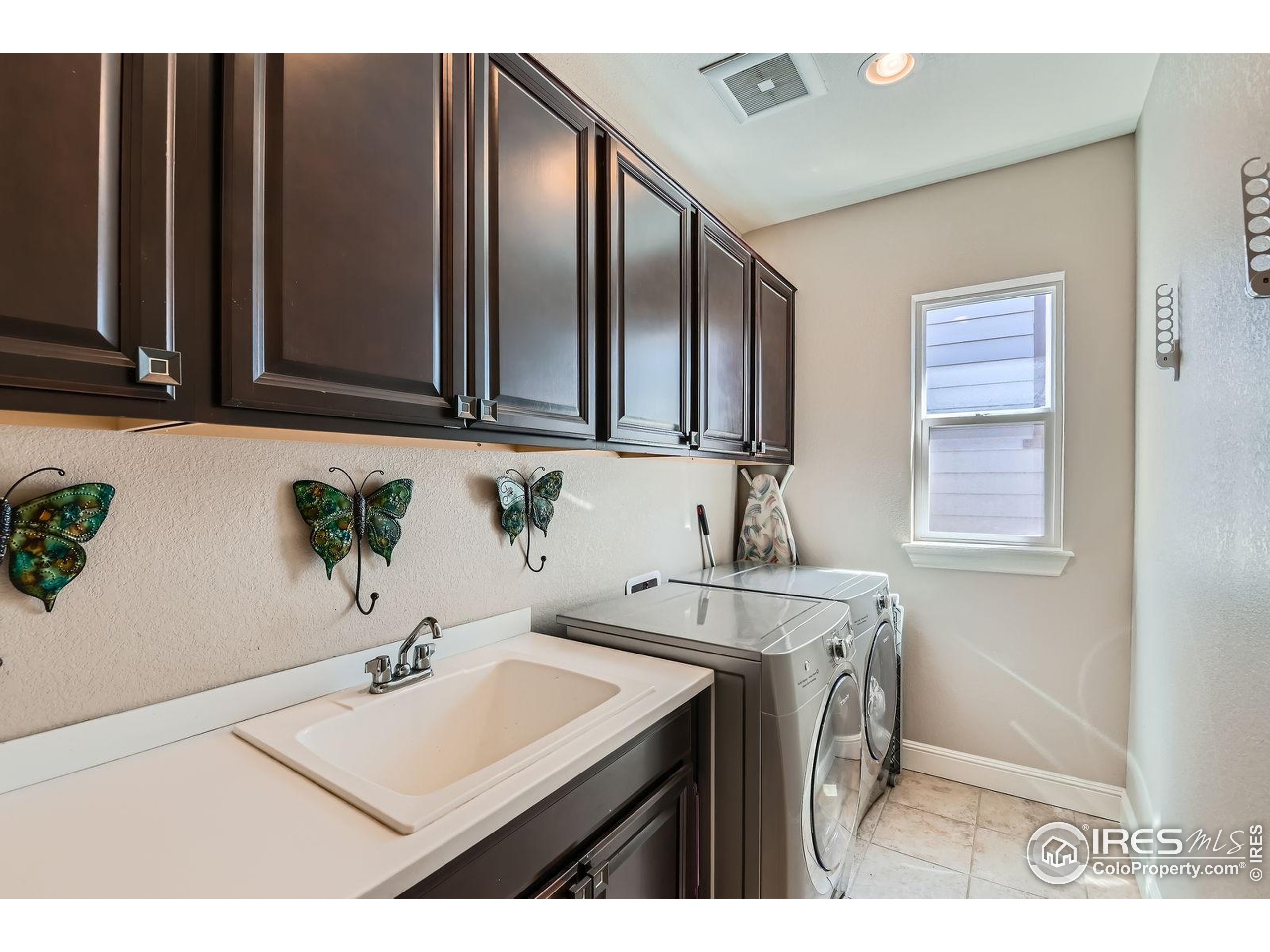 10834 Graphite Street Broomfield, CO 80021 - Photo 23 of 34 a bathroom with a sink and a mirror