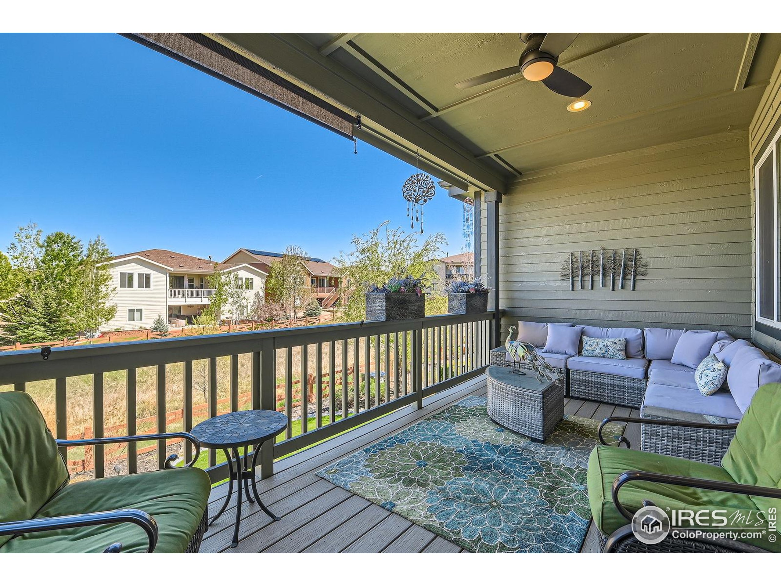 10834 Graphite Street Broomfield, CO 80021 - Photo 24 of 34 a view of a chairs and table in the balcony