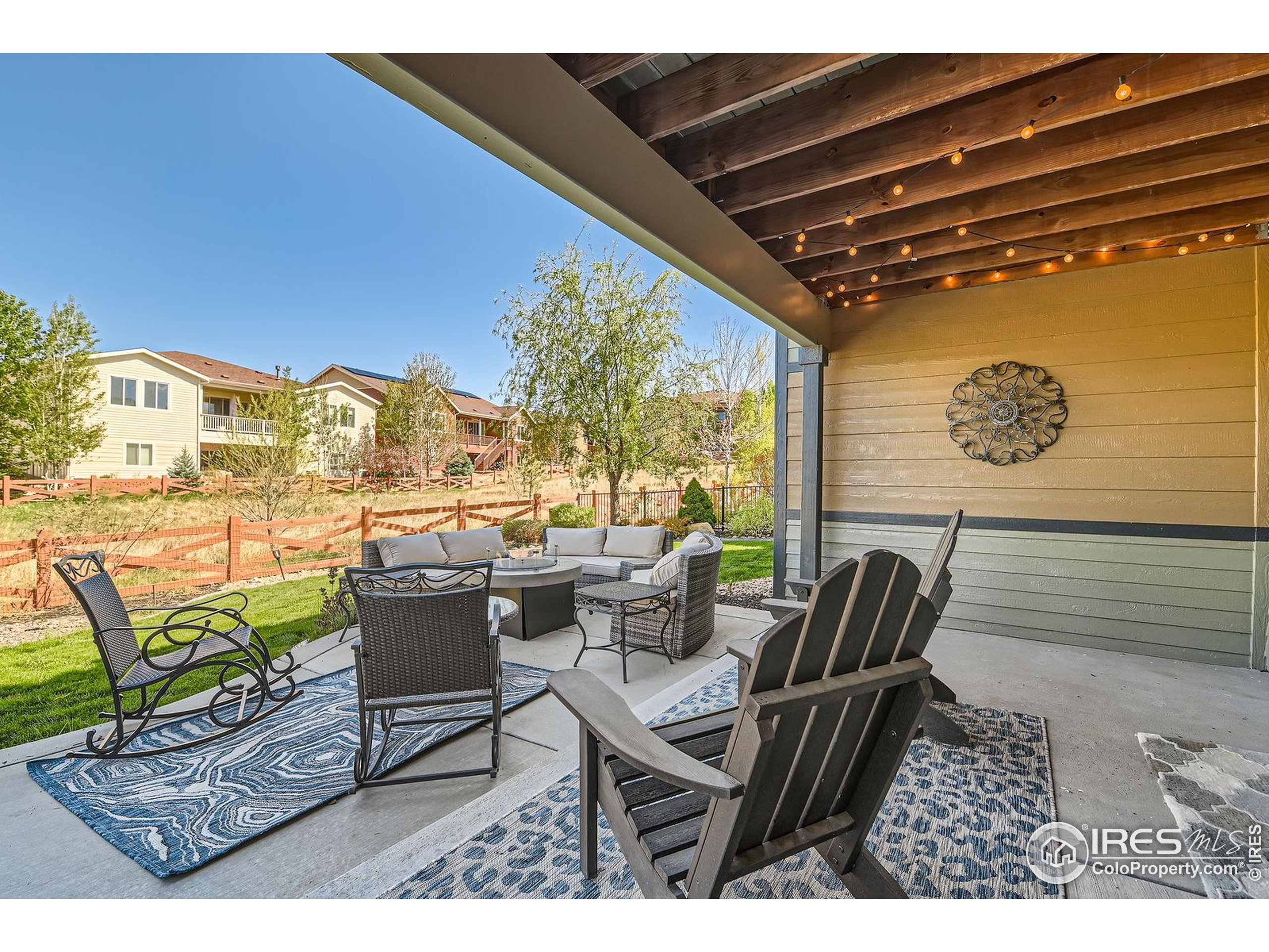 10834 Graphite Street Broomfield, CO 80021 - Photo 26 of 34 a view of living room filled with furniture and a table