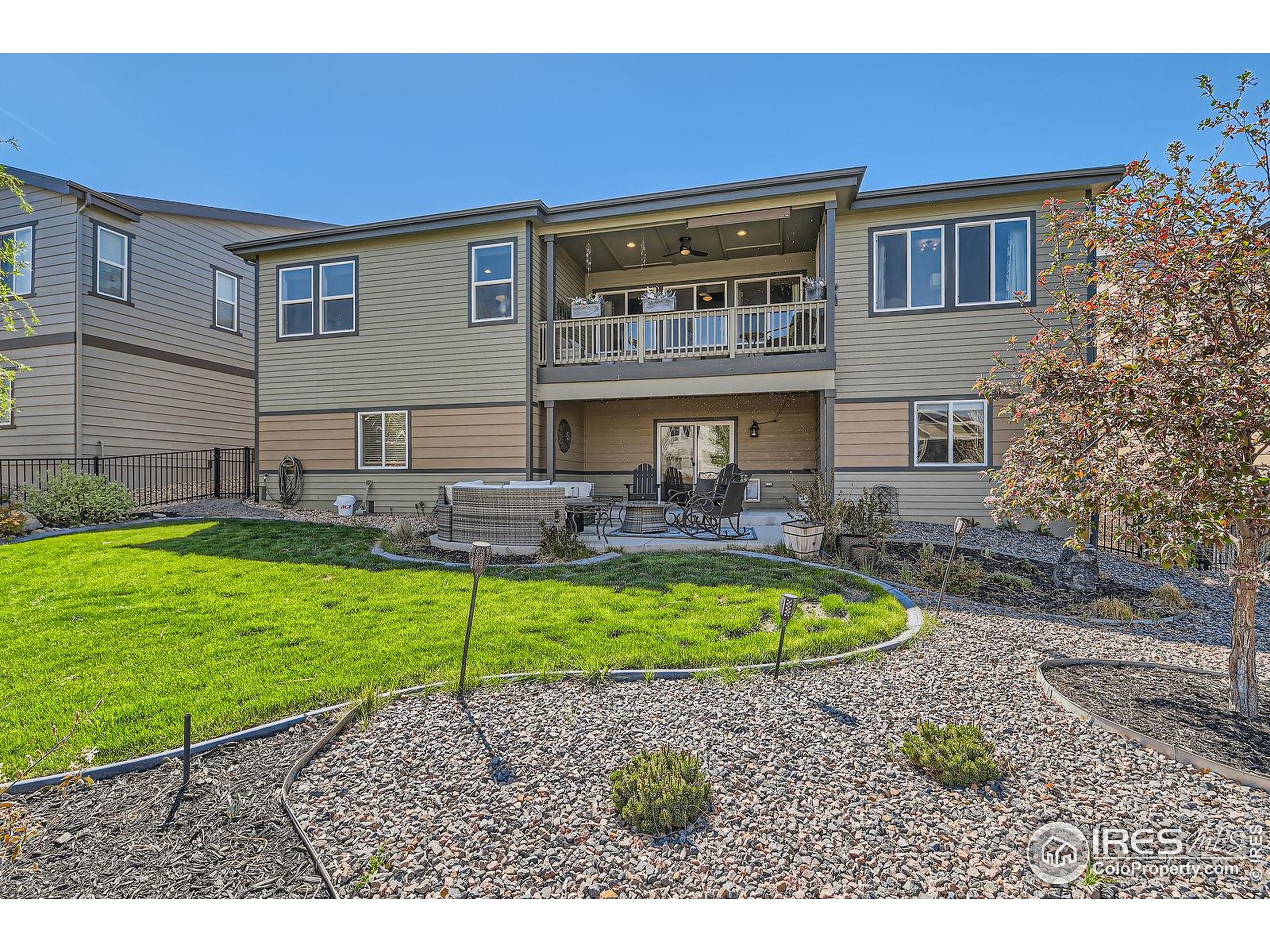 10834 Graphite Street Broomfield, CO 80021 - Photo 27 of 34 a front view of a house with a yard
