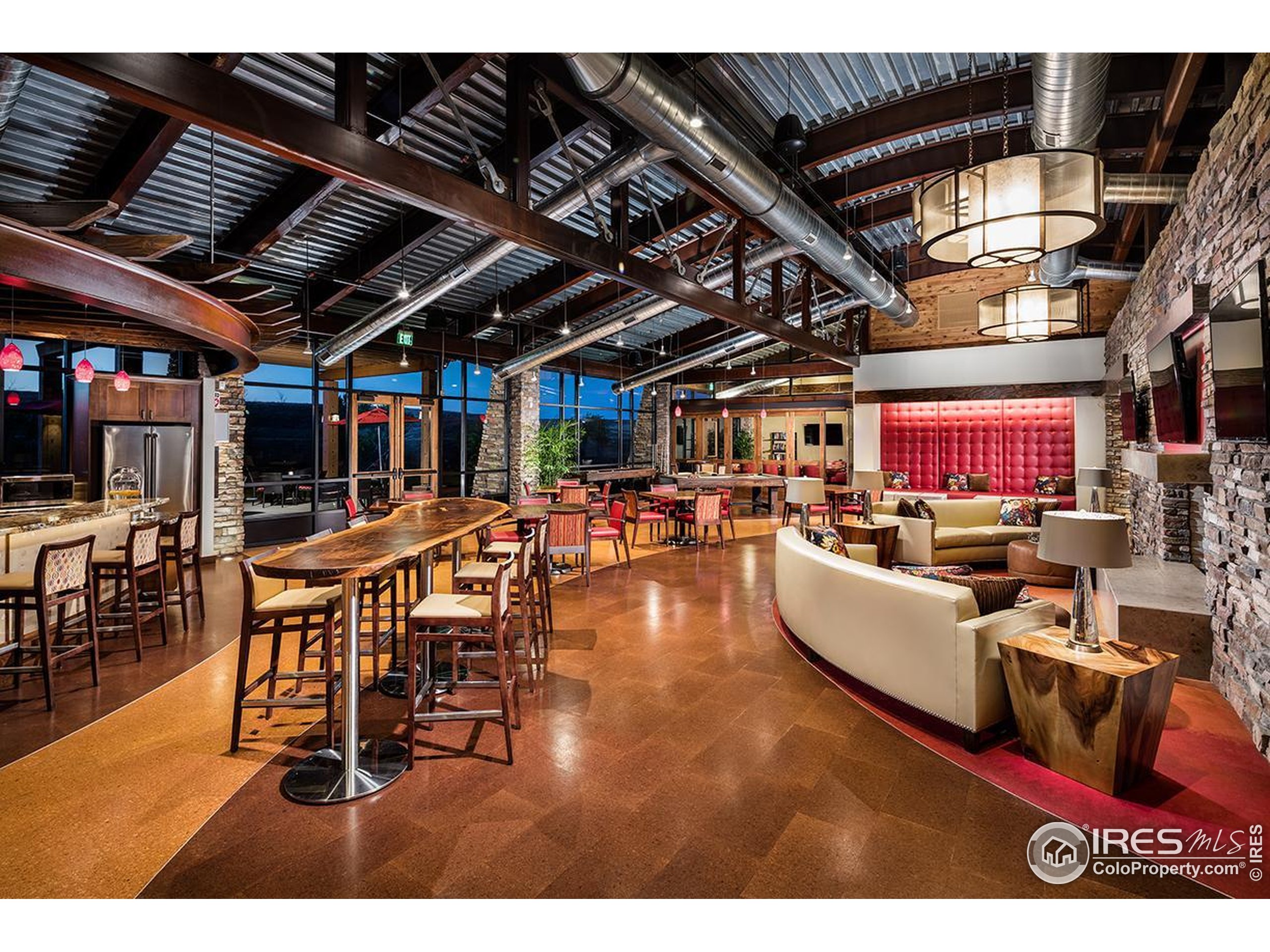 10834 Graphite Street Broomfield, CO 80021 - Photo 33 of 34 a living room with lots of furniture and kitchen