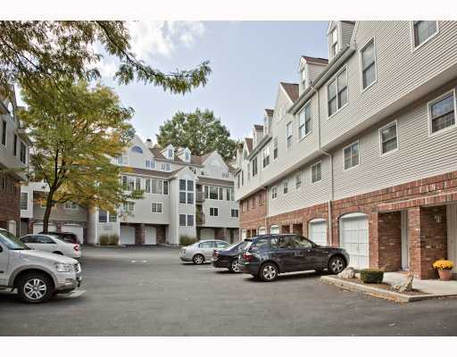 150 Prospect Street, Unit 7 Greenwich, CT 06830 - Photo 1 of 6 a car parked in front of a building