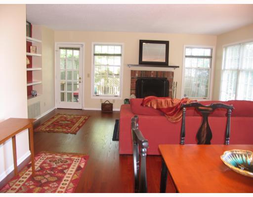 150 Prospect Street, Unit 7 Greenwich, CT 06830 - Photo 2 of 6 a living room with furniture and a fireplace