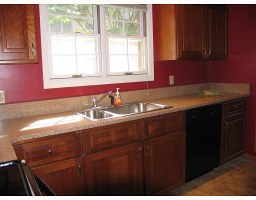 150 Prospect Street, Unit 7 Greenwich, CT 06830 - Photo 3 of 6 a kitchen with a sink and cabinets