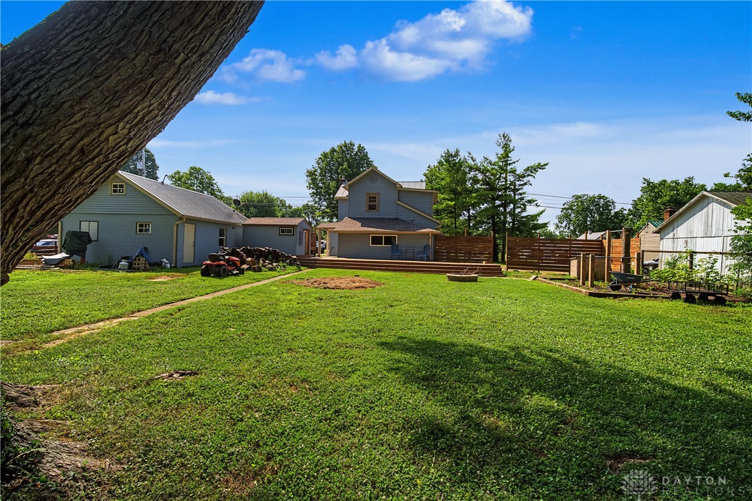8707 Lytle Ferry Road Waynesville, OH 45068 - Photo 35 of 54 A spacious backyard with an expansive wood deck, perfect for outdoor gatherings and relaxation.