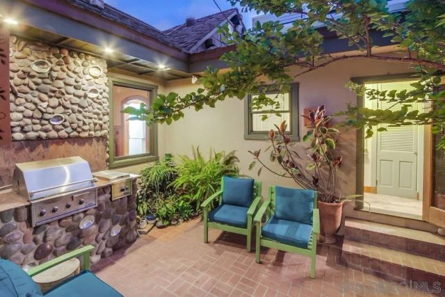 a view of a chairs and table in a patio