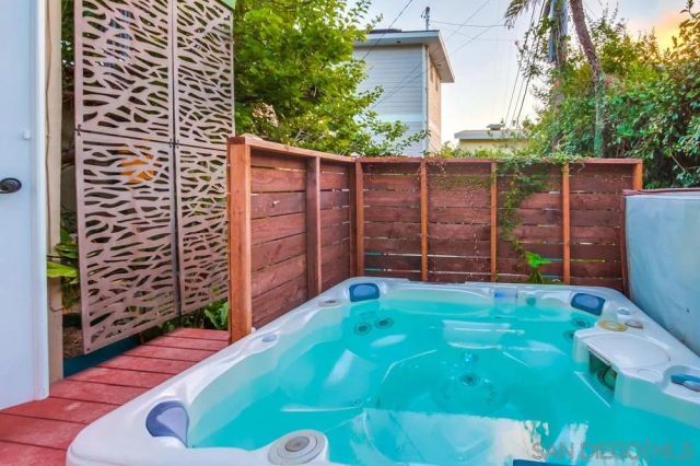 a view of a wooden door with a backyard