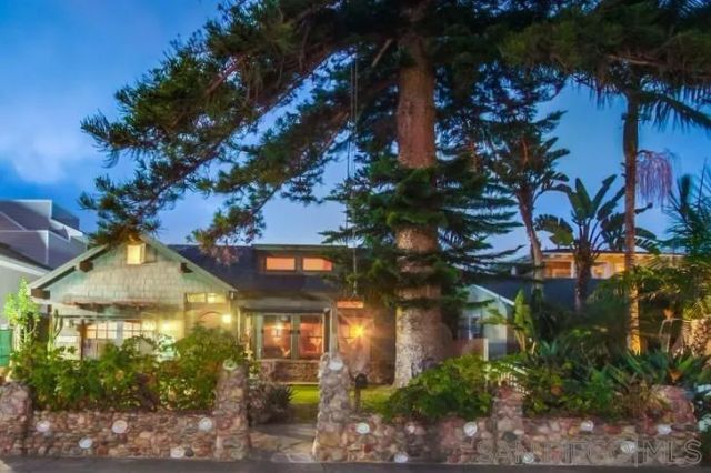 a view of a multi story building with a yard