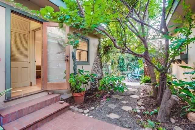 a backyard of a house with lots of green space