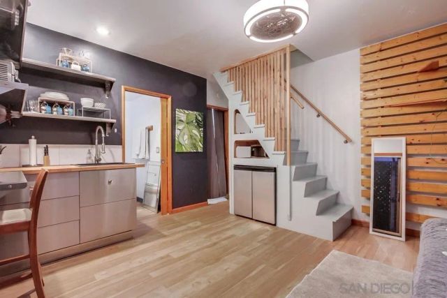 a view of kitchen with furniture and a window