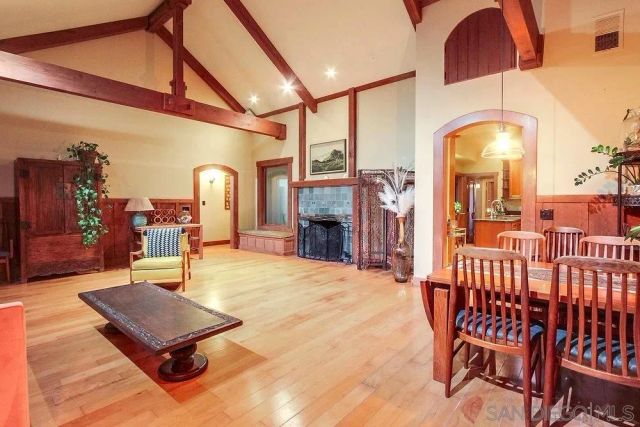 a room with lots of furniture and a chandelier