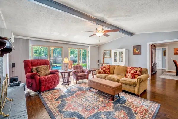 a living room with furniture and a large window