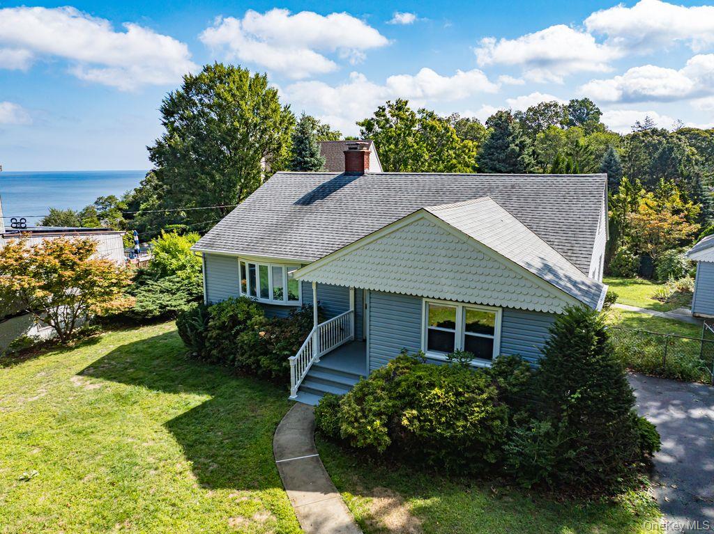 a aerial view of a house with garden and plants