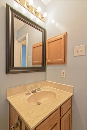 a bathroom with a sink and a mirror