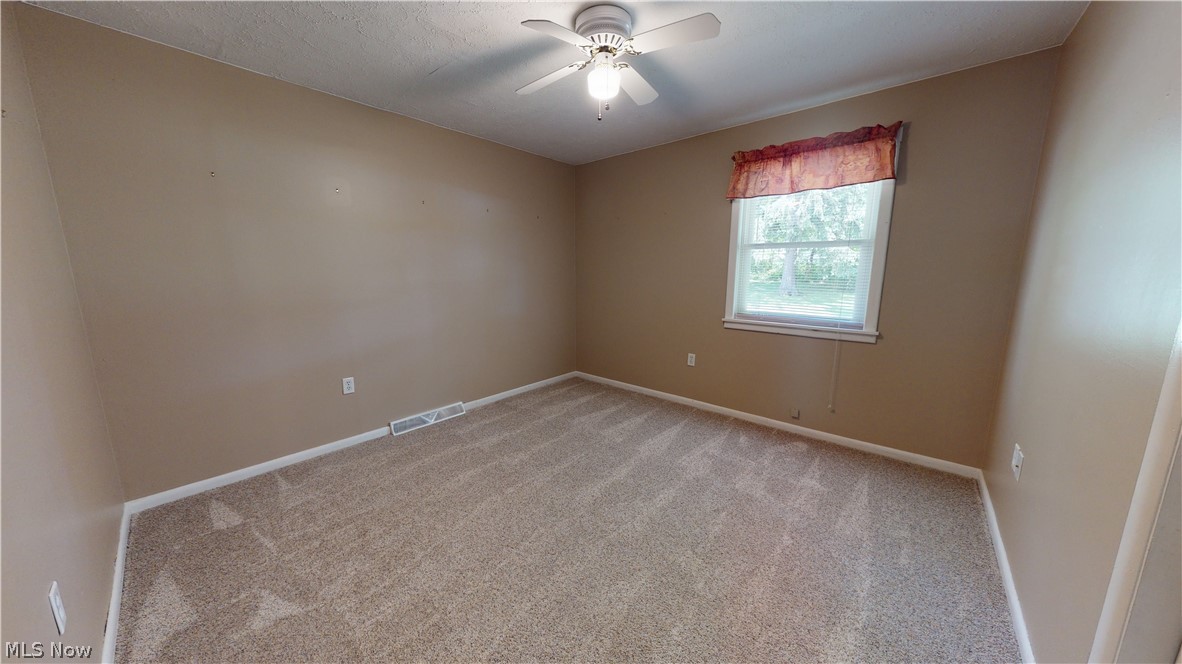 18142 Madison Road Middlefield, OH 44062 - Photo 20 of 35 Additional main floor bedroom. 12' x 11.5'