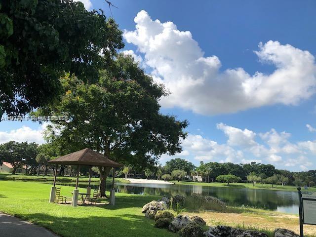 a view of a lake with a house in the background