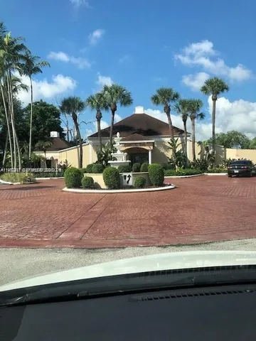 a living room with fireplace furniture and a flat screen tv