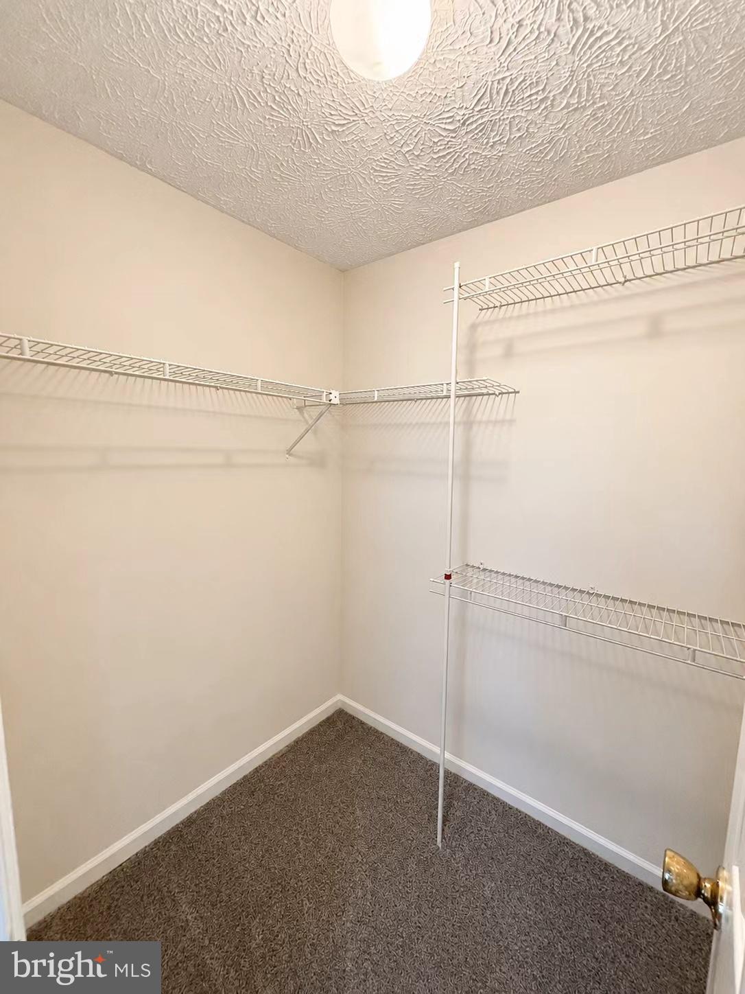 13336 Burkitts Road Fairfax, VA 22033 - Photo 10 of 14 a view of a room with racks on the wall