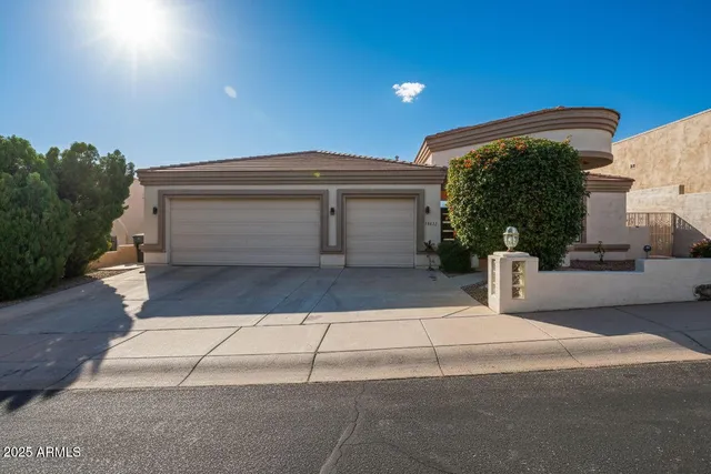 a front view of a house with a garage