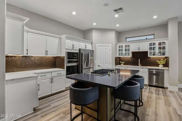 a view of a patio with swimming pool table and chairs