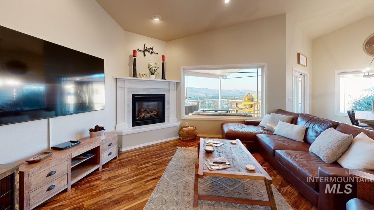 1724 Ridgeview Drive Clarkston, WA 99403 - Photo 15 of 48 Living room with wood finished floors, a fireplace, and recessed lighting