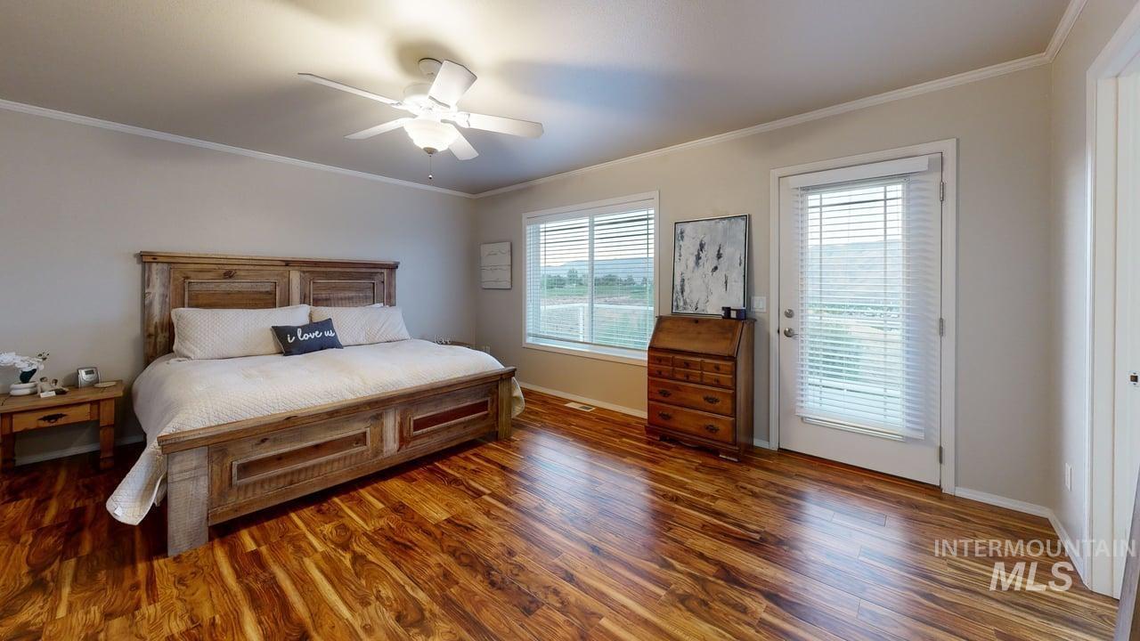 1724 Ridgeview Drive Clarkston, WA 99403 - Photo 19 of 48 Bedroom featuring ornamental molding, wood finished floors, and a ceiling fan