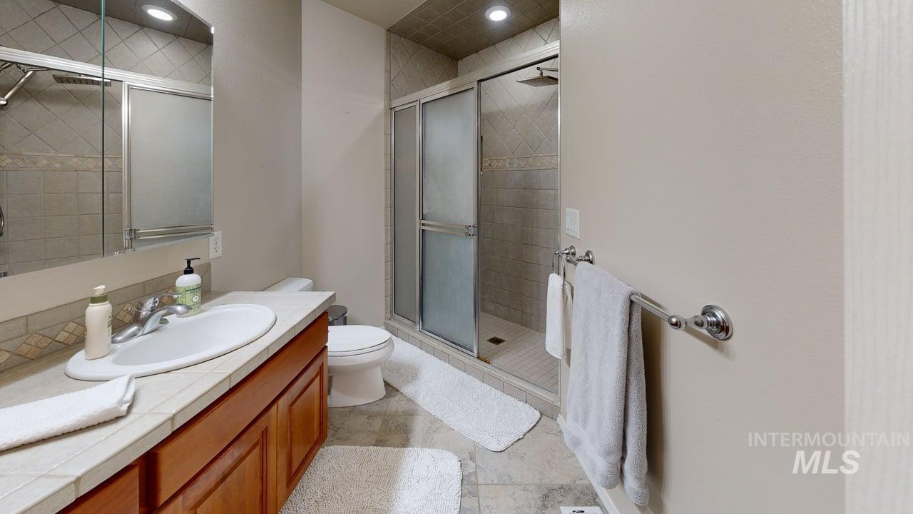 1724 Ridgeview Drive Clarkston, WA 99403 - Photo 22 of 48 Bathroom featuring a shower stall and vanity