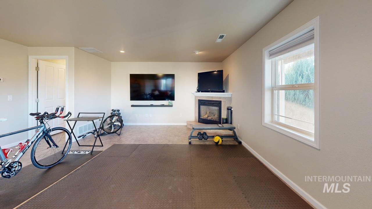 1724 Ridgeview Drive Clarkston, WA 99403 - Photo 33 of 48 Carpeted living area with a tile fireplace and recessed lighting