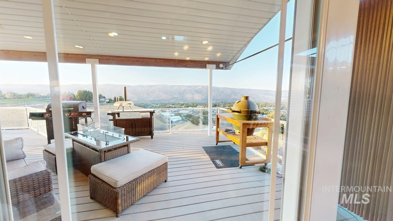 1724 Ridgeview Drive Clarkston, WA 99403 - Photo 6 of 48 Wooden terrace with a mountain view and grilling area