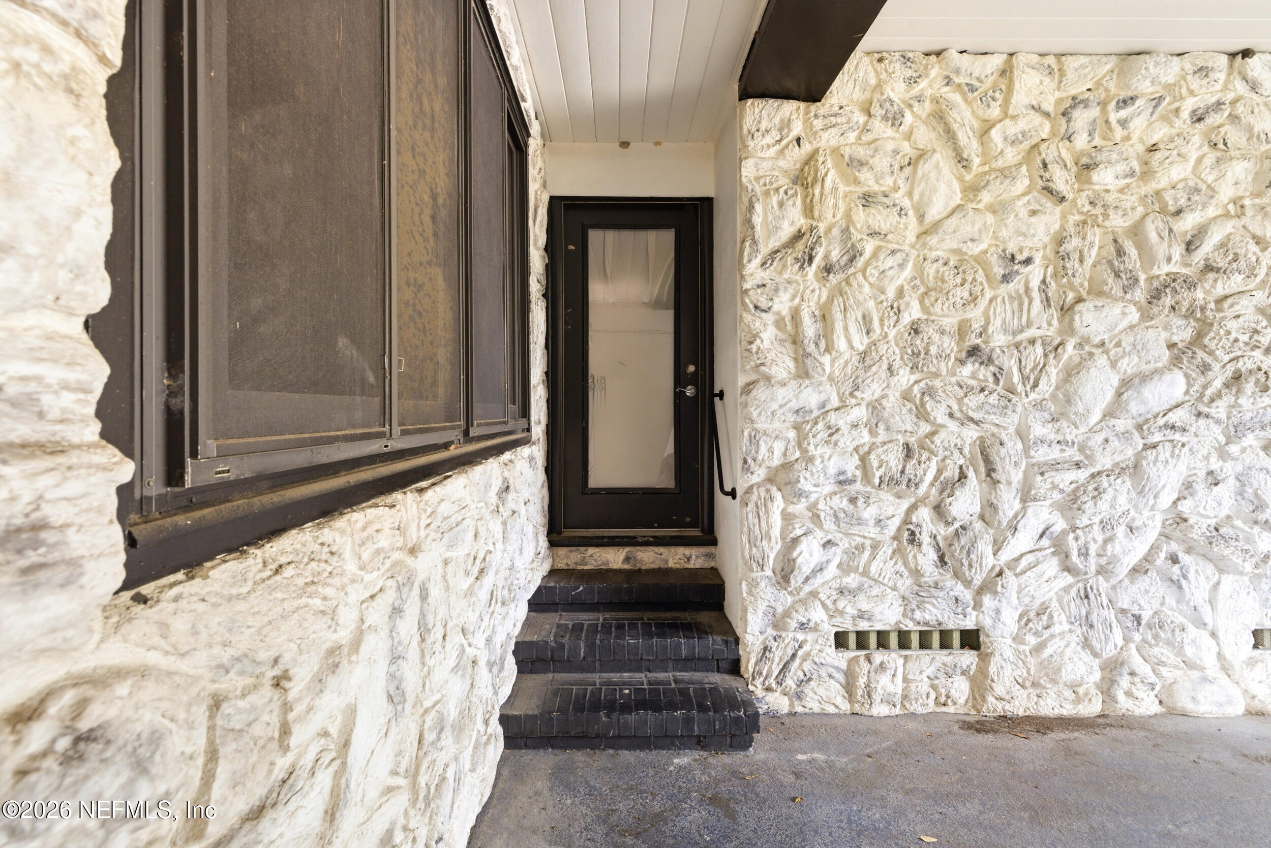 7484 Spinola Road Jacksonville, FL 32217 - Photo 48 of 63 a view of the entrance door of the house