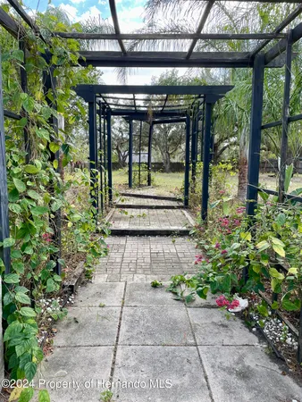 a view of a pathway with a porch