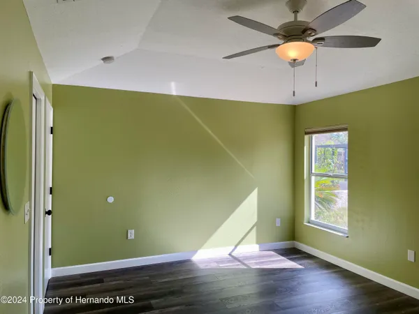 a view of a room with gym equipment and a window