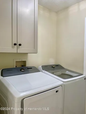 a bathroom with a sink and cabinets