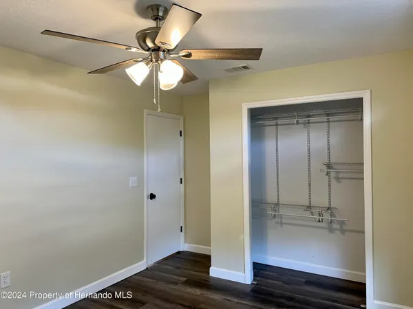 a bathroom with a mirror and a shower