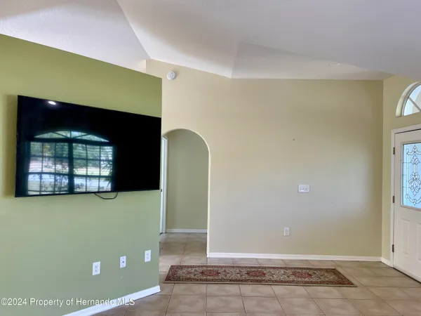 a view of room with window and fireplace