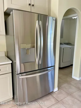 a view of a refrigerator in kitchen