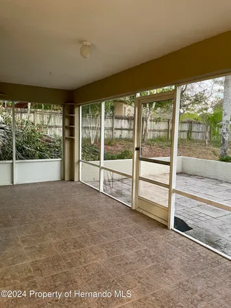 a view of an empty room with a large window