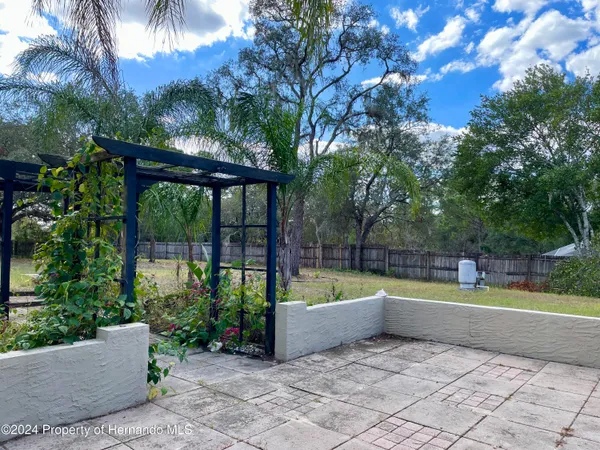 a view of a swimming pool with a patio