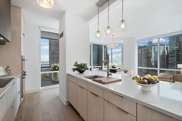 a kitchen with sink and refrigerator