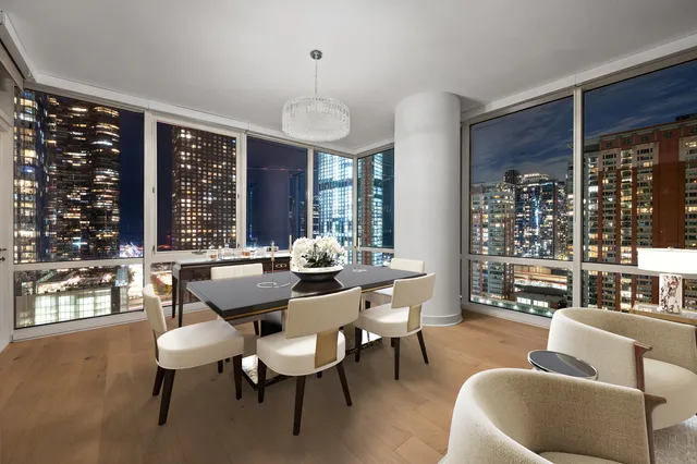 a view of a dining room with furniture window and outside view