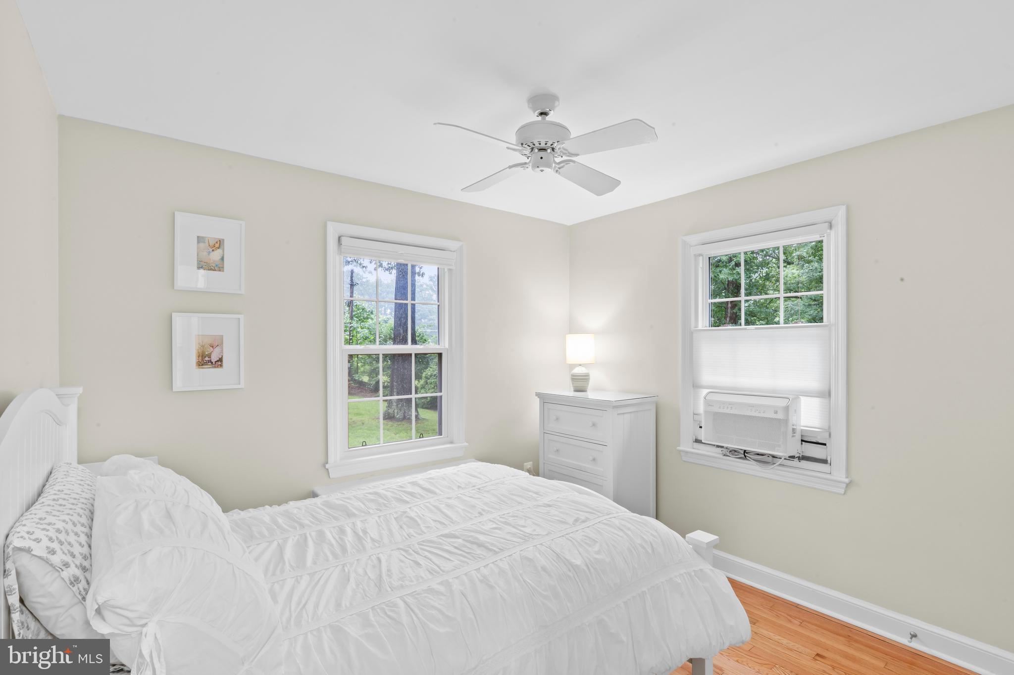 12131 Waples Mill Road Oakton, VA 22124 - Photo 9 of 40 a bedroom with a large bed and a window